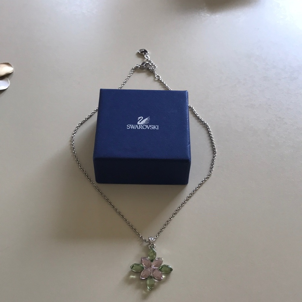Swarovski necklace with green and pink flower.